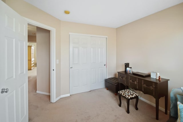 home office with carpet floors and baseboards