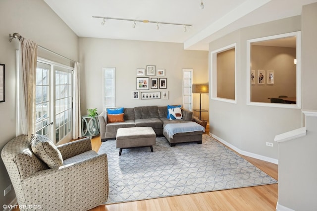 living room with light wood finished floors and baseboards