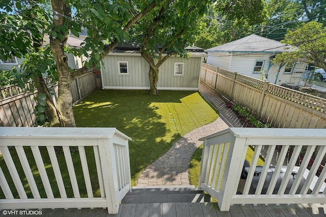 view of yard featuring an outbuilding and a fenced backyard