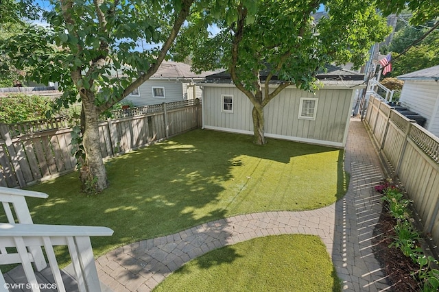 view of yard featuring a fenced backyard