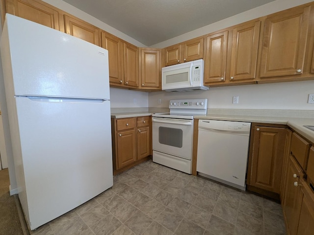 kitchen featuring white appliances and light countertops