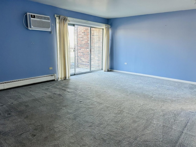 carpeted spare room with a baseboard heating unit, an AC wall unit, and baseboards