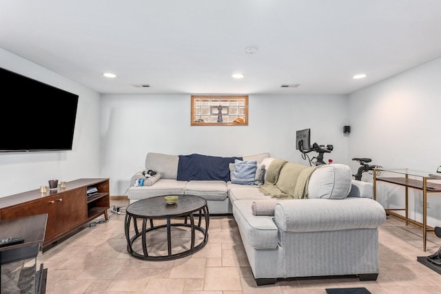 living area with recessed lighting and visible vents