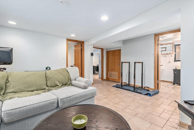 living room featuring recessed lighting, visible vents, and baseboards