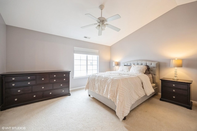 bedroom with light carpet, baseboards, visible vents, a ceiling fan, and vaulted ceiling