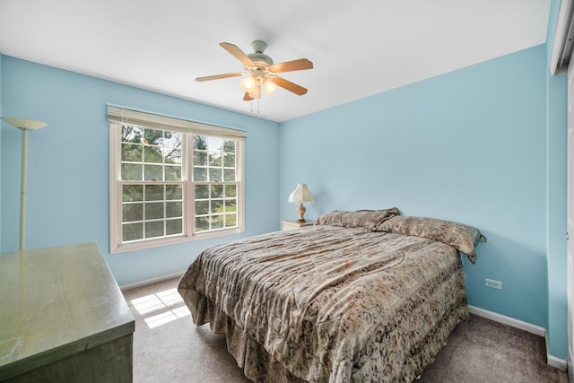 carpeted bedroom featuring ceiling fan and baseboards