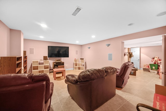 living area featuring light tile patterned floors, baseboards, visible vents, and recessed lighting