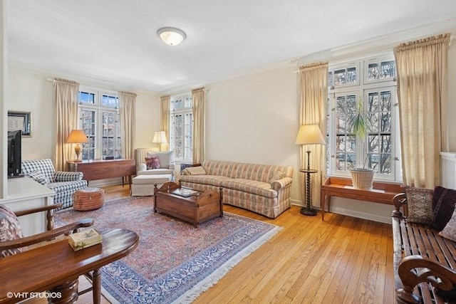 sitting room with light wood finished floors and baseboards