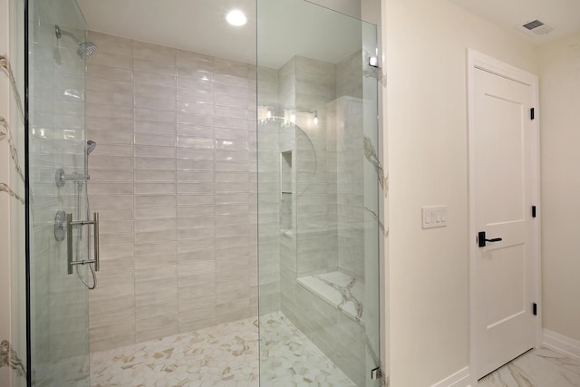 bathroom featuring a stall shower, baseboards, visible vents, and marble finish floor