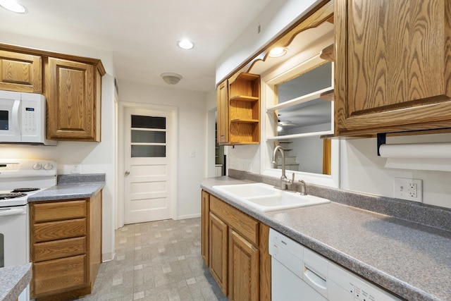 kitchen featuring white appliances, open shelves, recessed lighting, a sink, and brown cabinets