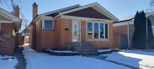 view of front of house featuring brick siding