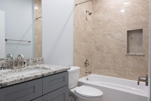 full bath featuring tub / shower combination, vanity, and toilet