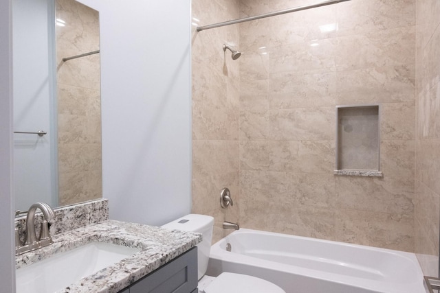 bathroom with shower / washtub combination, vanity, and toilet