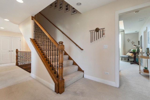 staircase featuring carpet floors, recessed lighting, visible vents, and baseboards