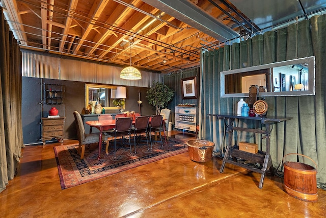 dining area featuring concrete flooring