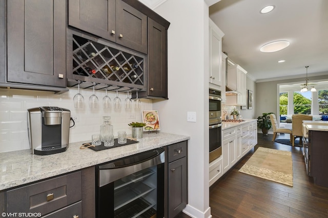 kitchen with dark brown cabinetry, white cabinets, decorative backsplash, dark wood finished floors, and wine cooler