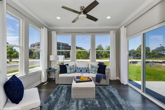 sunroom / solarium with a ceiling fan