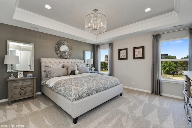 bedroom featuring baseboards, a tray ceiling, and light colored carpet