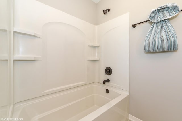 full bathroom featuring baseboards and shower / bathtub combination