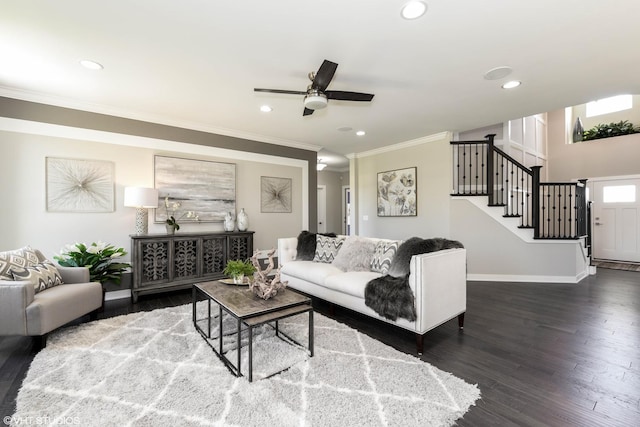 living room with recessed lighting, wood finished floors, baseboards, stairs, and ornamental molding