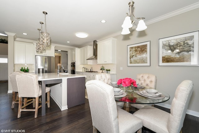 dining room with dark wood-style flooring and crown molding