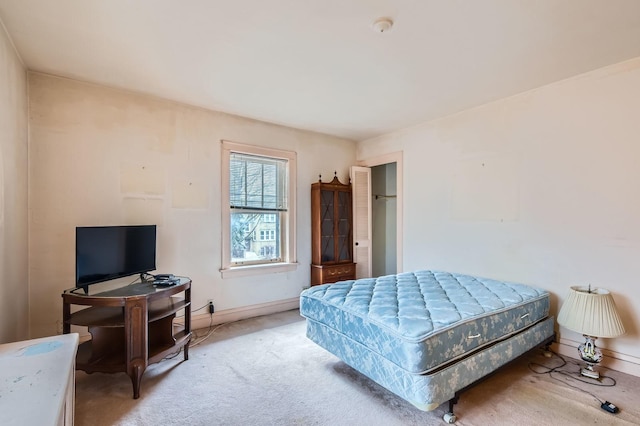 bedroom with baseboards and carpet flooring