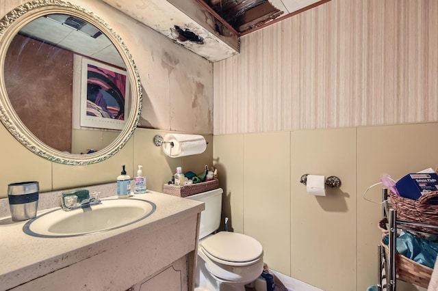 bathroom featuring toilet and vanity