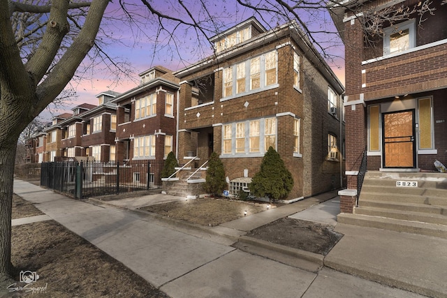 multi unit property featuring brick siding