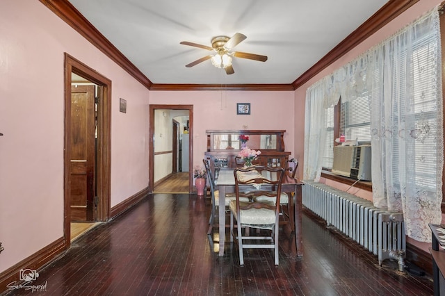 dining room featuring hardwood / wood-style floors, radiator heating unit, ornamental molding, and baseboards