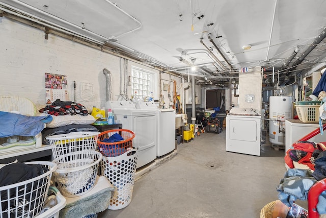 below grade area with washer and clothes dryer and gas water heater