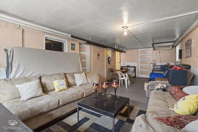 living area featuring finished concrete flooring