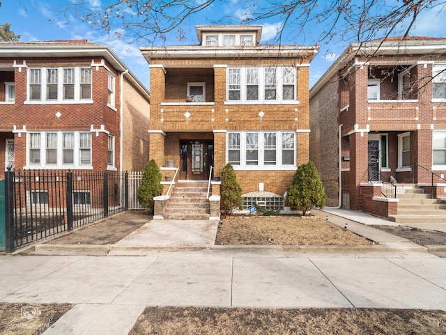 traditional style home featuring brick siding and fence