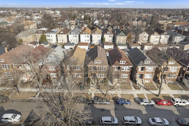 birds eye view of property with a residential view