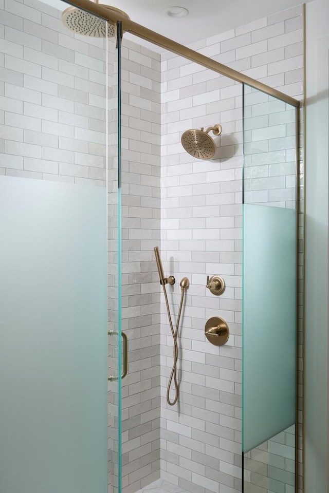 full bath featuring a shower stall
