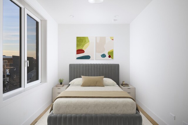 bedroom featuring baseboards