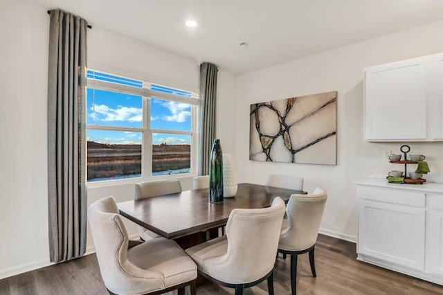 dining space featuring recessed lighting, baseboards, and wood finished floors