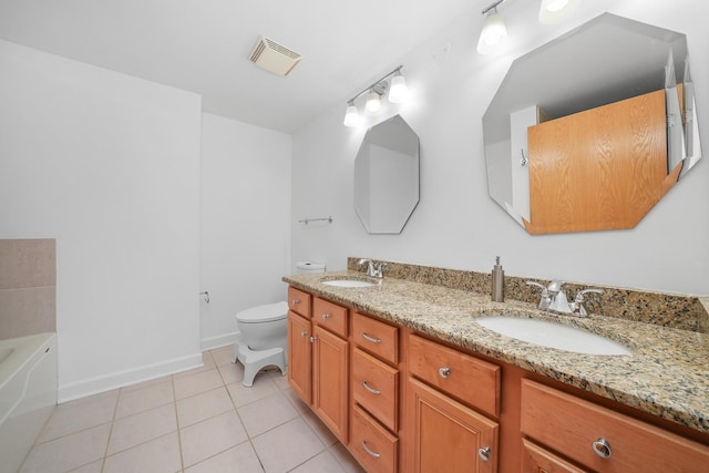 bathroom featuring double vanity, visible vents, toilet, a sink, and tile patterned flooring