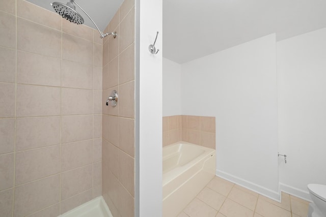 bathroom with baseboards, tiled shower, toilet, tile patterned flooring, and a bath