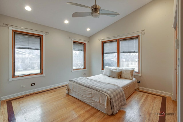 bedroom with lofted ceiling, light wood-style flooring, baseboards, and recessed lighting