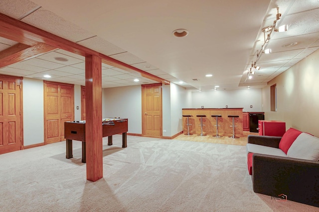 playroom featuring recessed lighting, bar, carpet floors, baseboards, and rail lighting