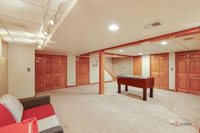 playroom with light carpet, visible vents, and baseboards