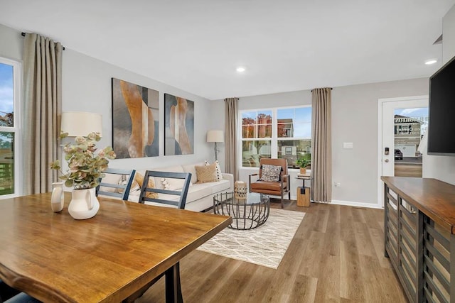 interior space with recessed lighting, baseboards, and wood finished floors