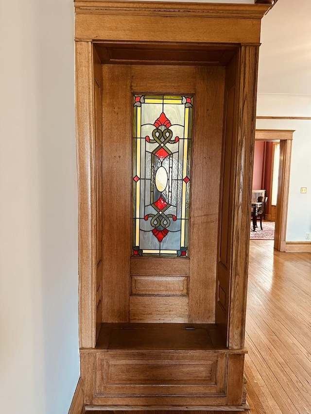 interior details featuring baseboards and wood finished floors