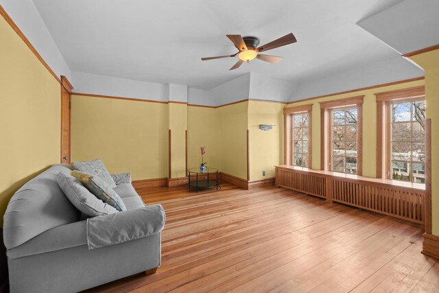 interior space featuring a ceiling fan and hardwood / wood-style flooring