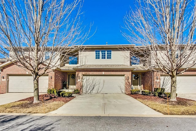 view of front of home featuring brick siding and driveway