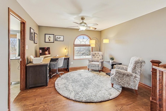 office with baseboards, ceiling fan, and wood finished floors