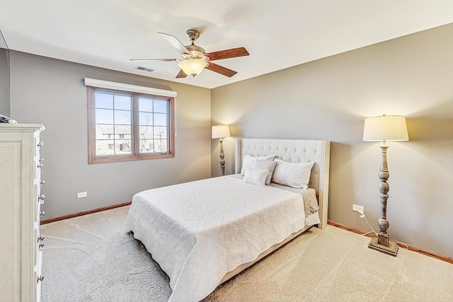 bedroom with visible vents, carpet flooring, baseboards, and ceiling fan