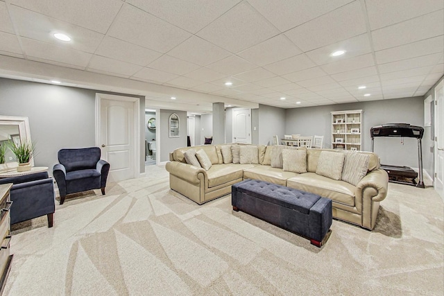 living room featuring carpet flooring, recessed lighting, and a paneled ceiling