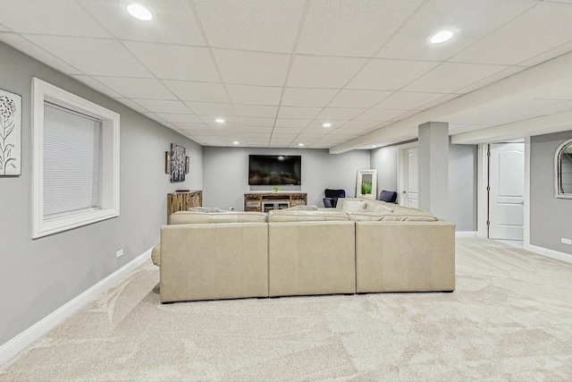 living area with recessed lighting, a drop ceiling, baseboards, and carpet flooring