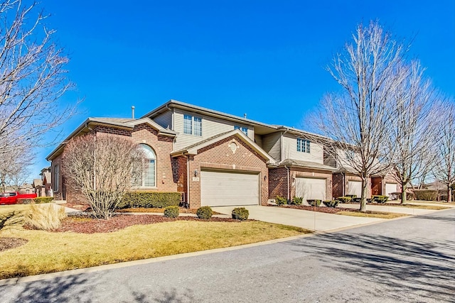 view of front of home featuring brick siding and driveway